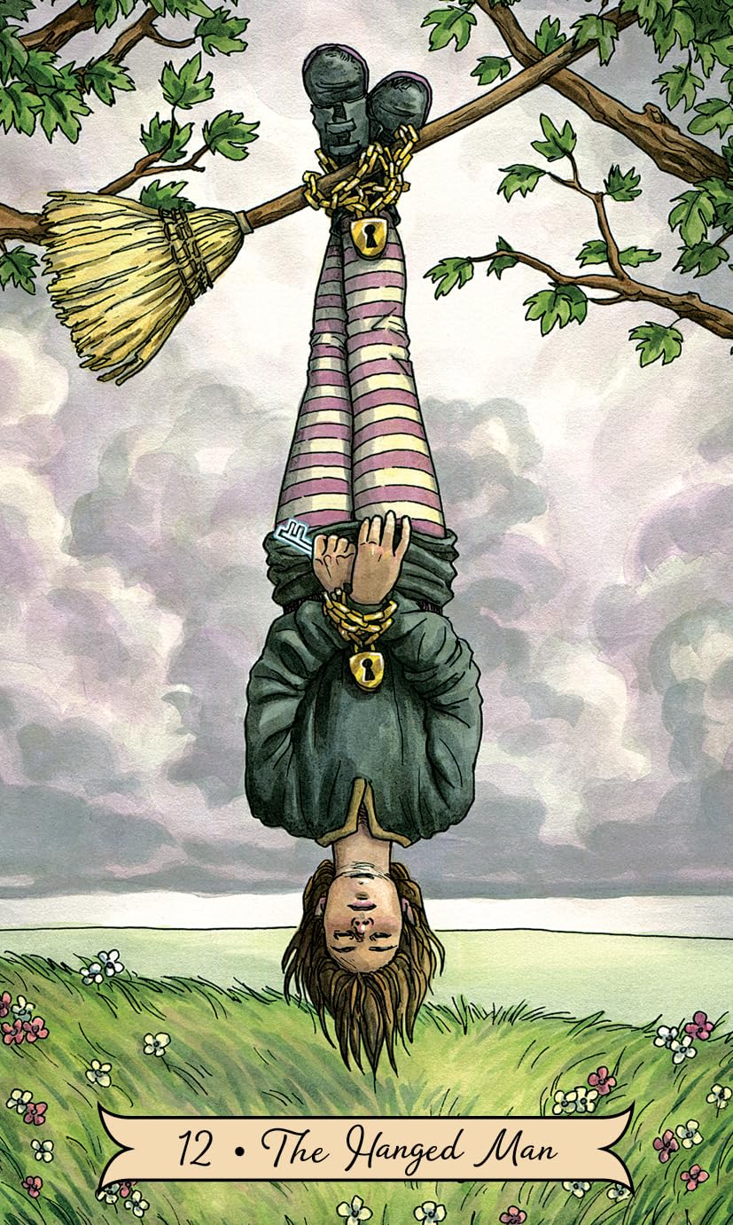 Card from a tarot deck showing 'The Hanged Man' with a person hanging upside down from a tree branch.