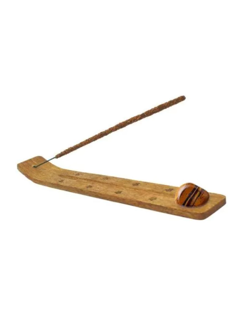 Wooden incense burner with a stick on a white background