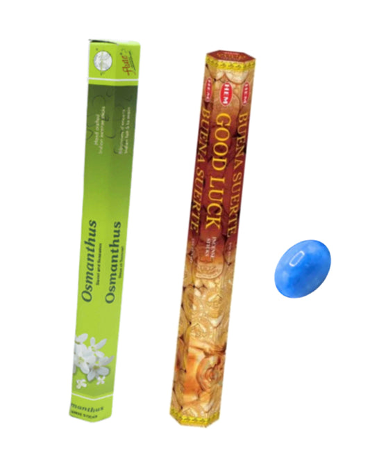 Two incense sticks with packaging labeled 'Osmanthus' and 'Good Luck', and a blue ball on a white background.
